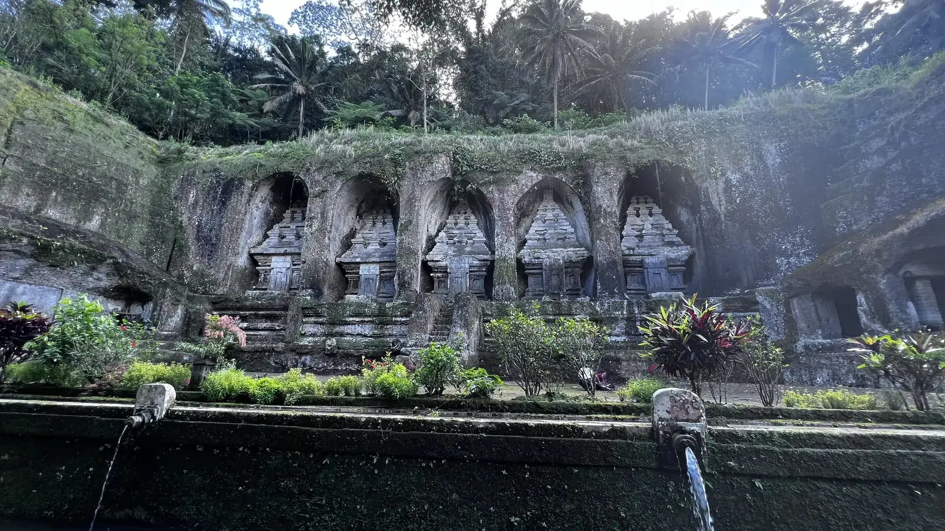 The ancient Gunung Kawi temple complex surrounded by rice terraces in Bali, Indonesia