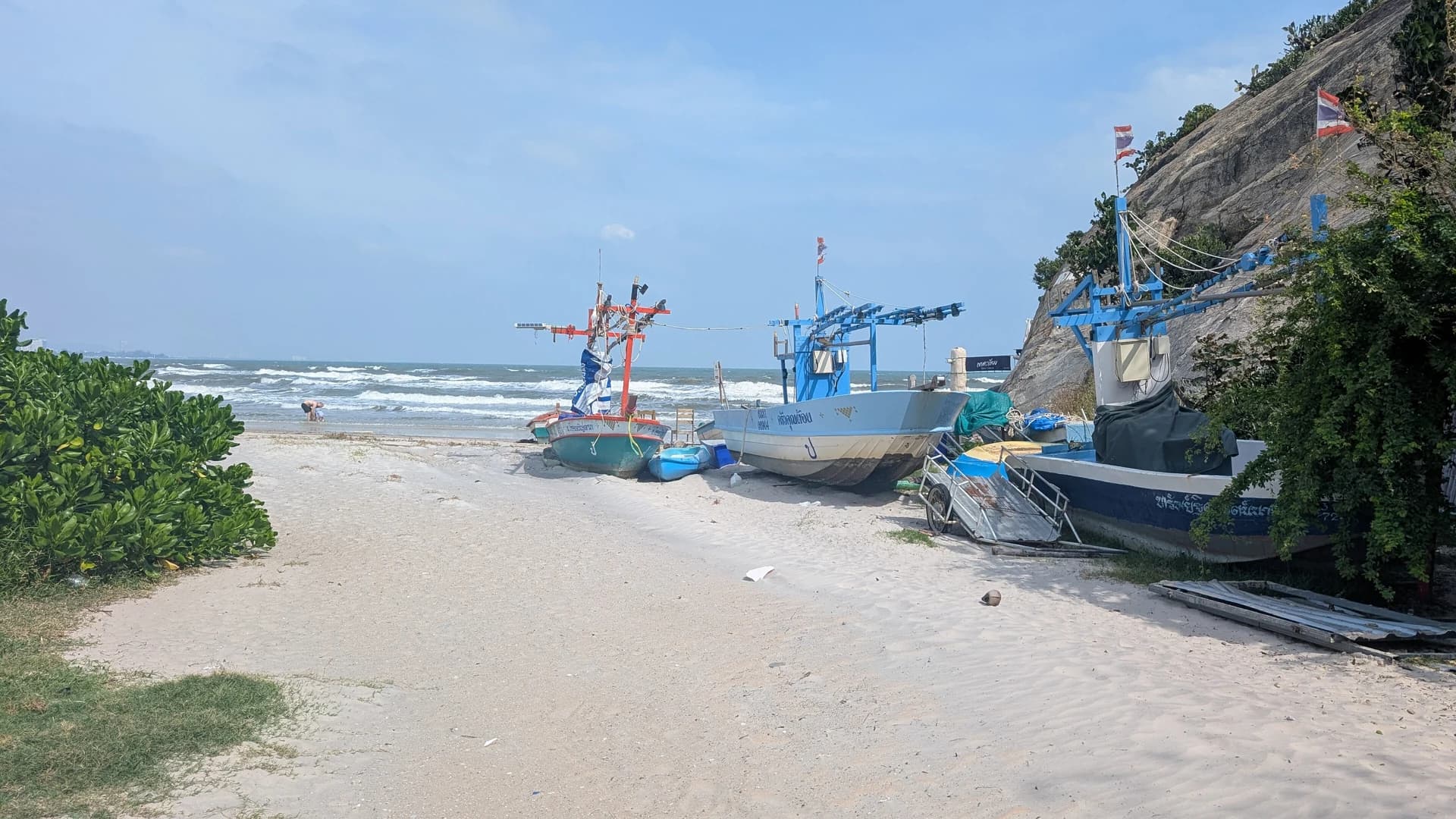 Sandy beach with traditional fishing boats in Hua Hin, Thailand