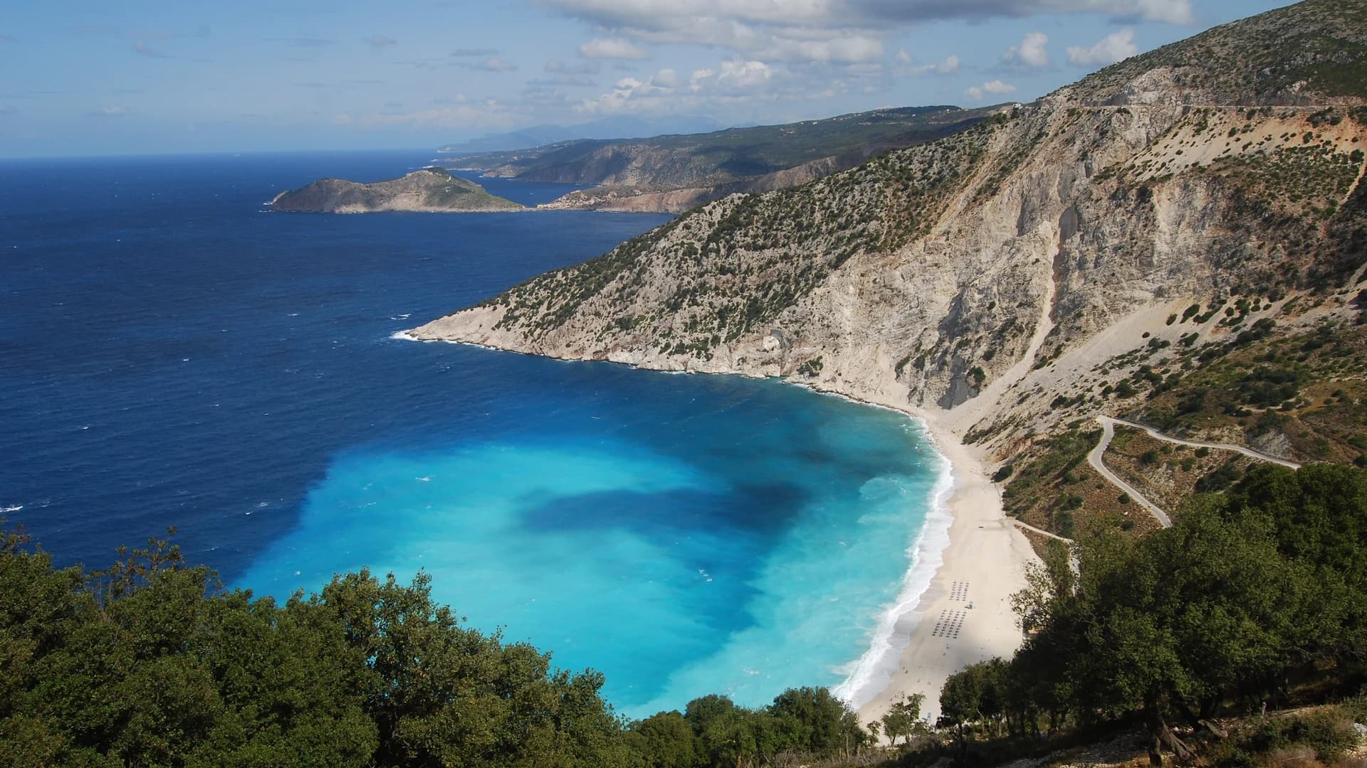 Myrtos Beach and its turquoise bay below white cliffs, Kefalonia, Greece