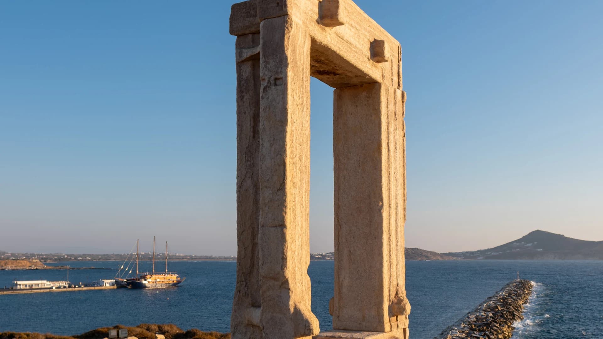 The Portara, ancient marble temple gate at Naxos Chora, at sunset