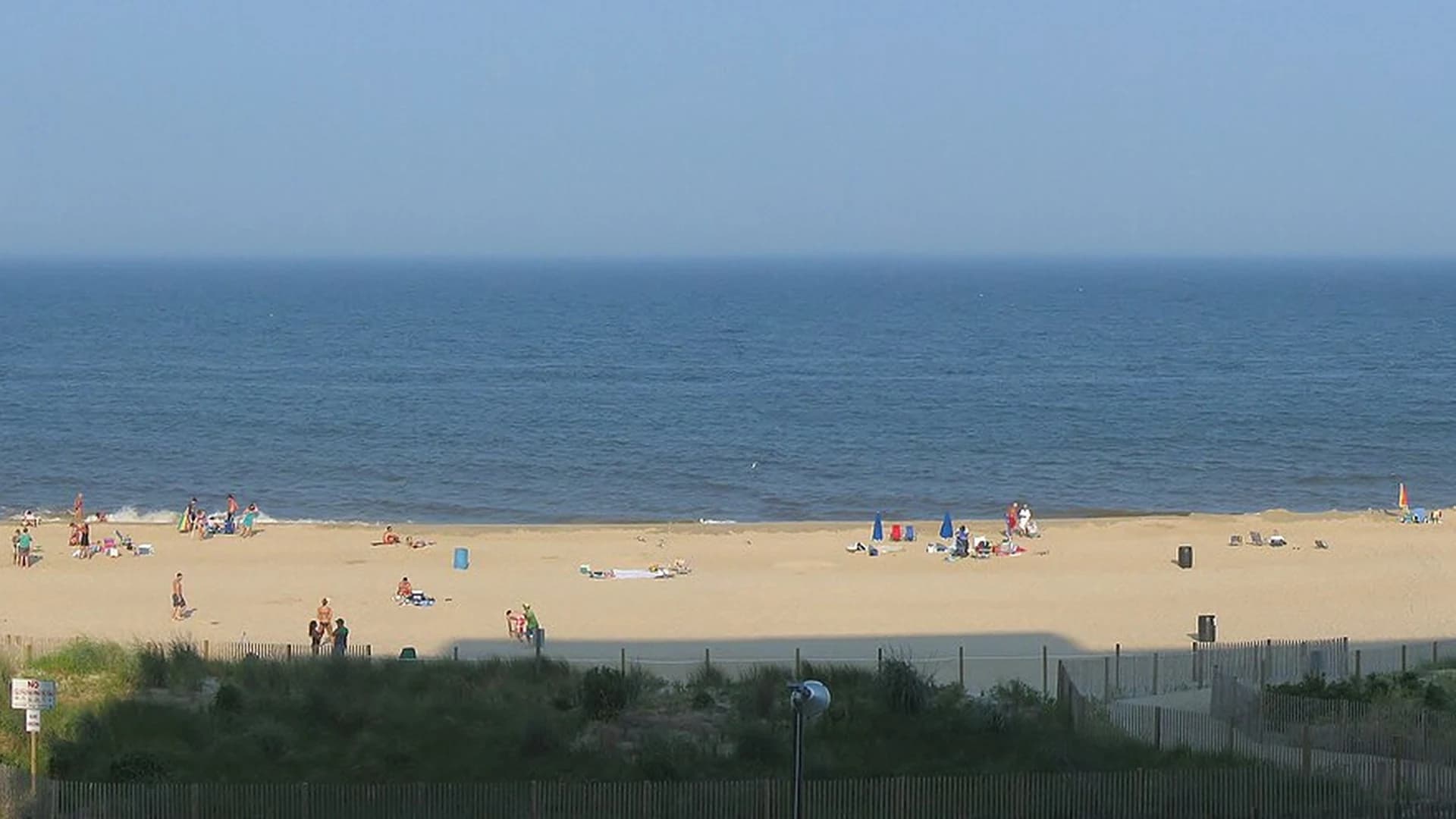 Wide sandy beach and Atlantic Ocean at Ocean City, Maryland, seen from the dunes