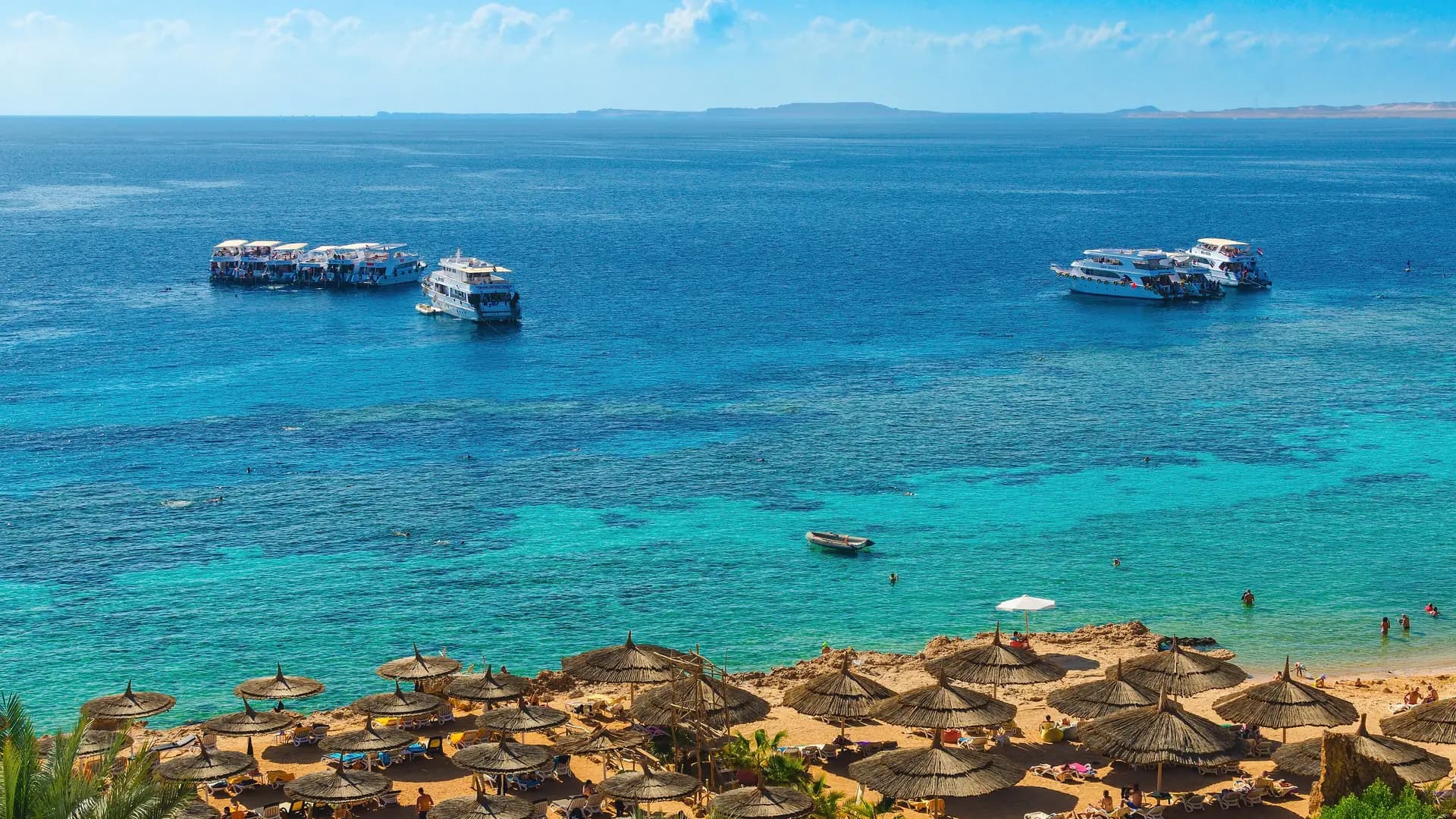 Excursion boats moored over the reef at Ras Um Sid, Sharm El Sheikh, Egypt