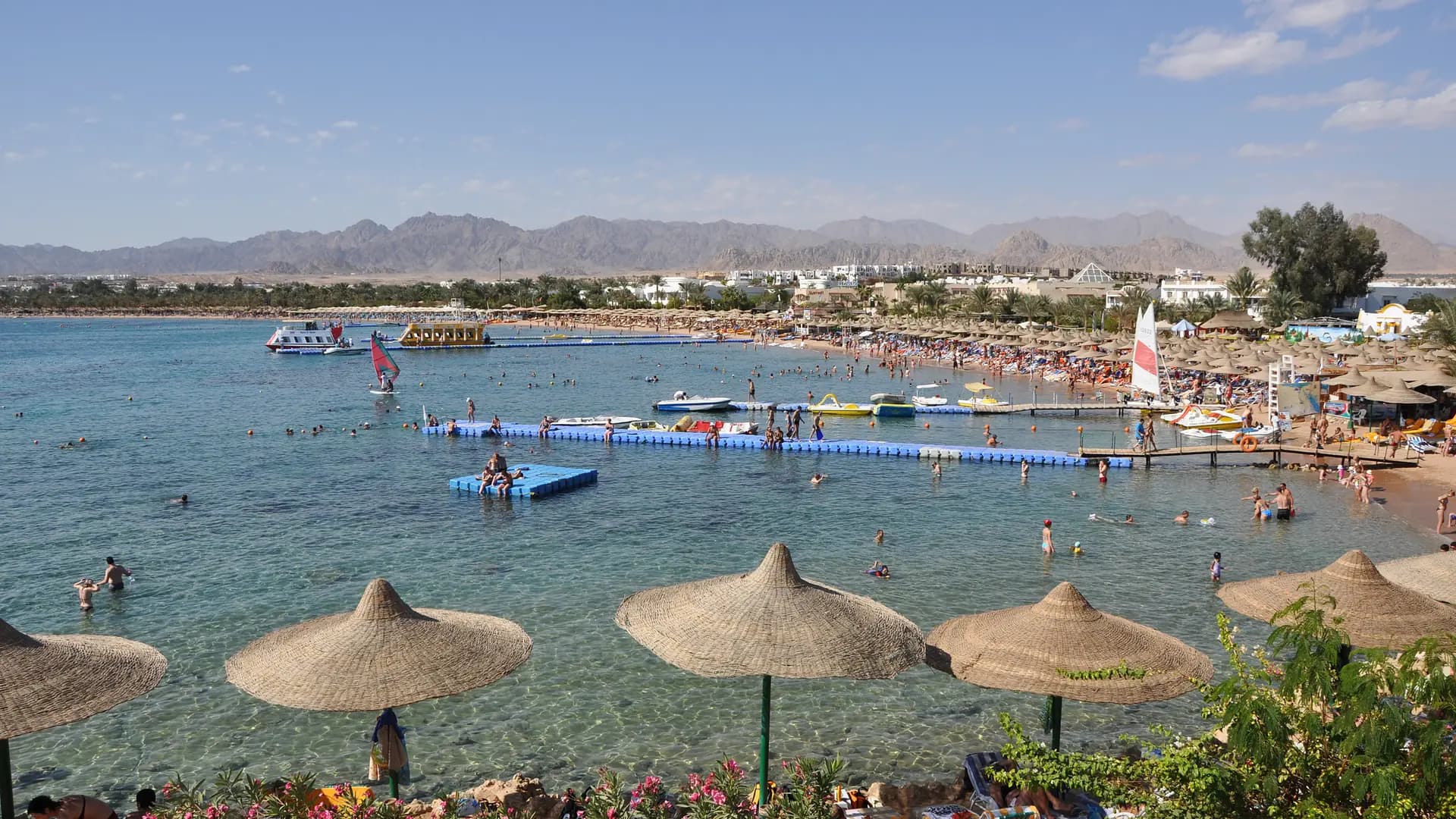 Naama Bay beach in Sharm El Sheikh, Egypt, with the Sinai mountains behind