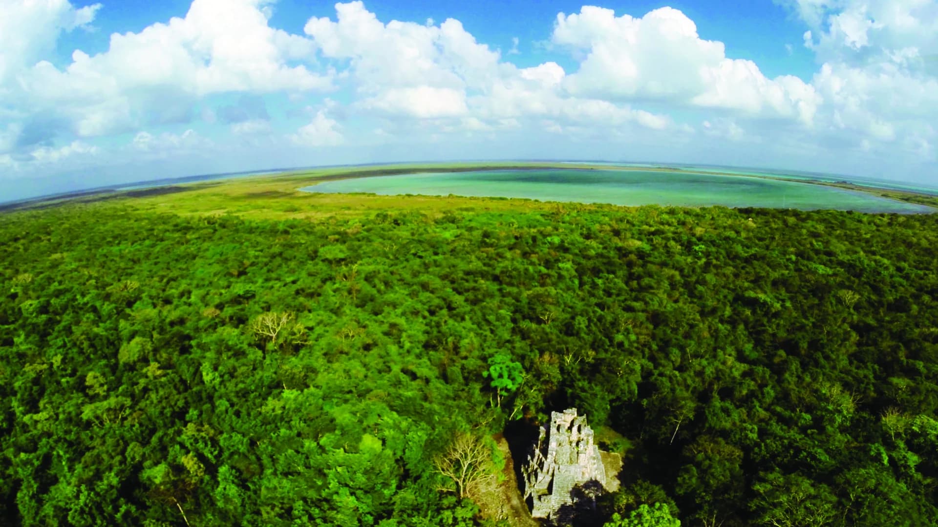 Aerial view over jungle, a Maya pyramid and the lagoon system of the Sian Ka'an Biosphere Reserve, Mexico