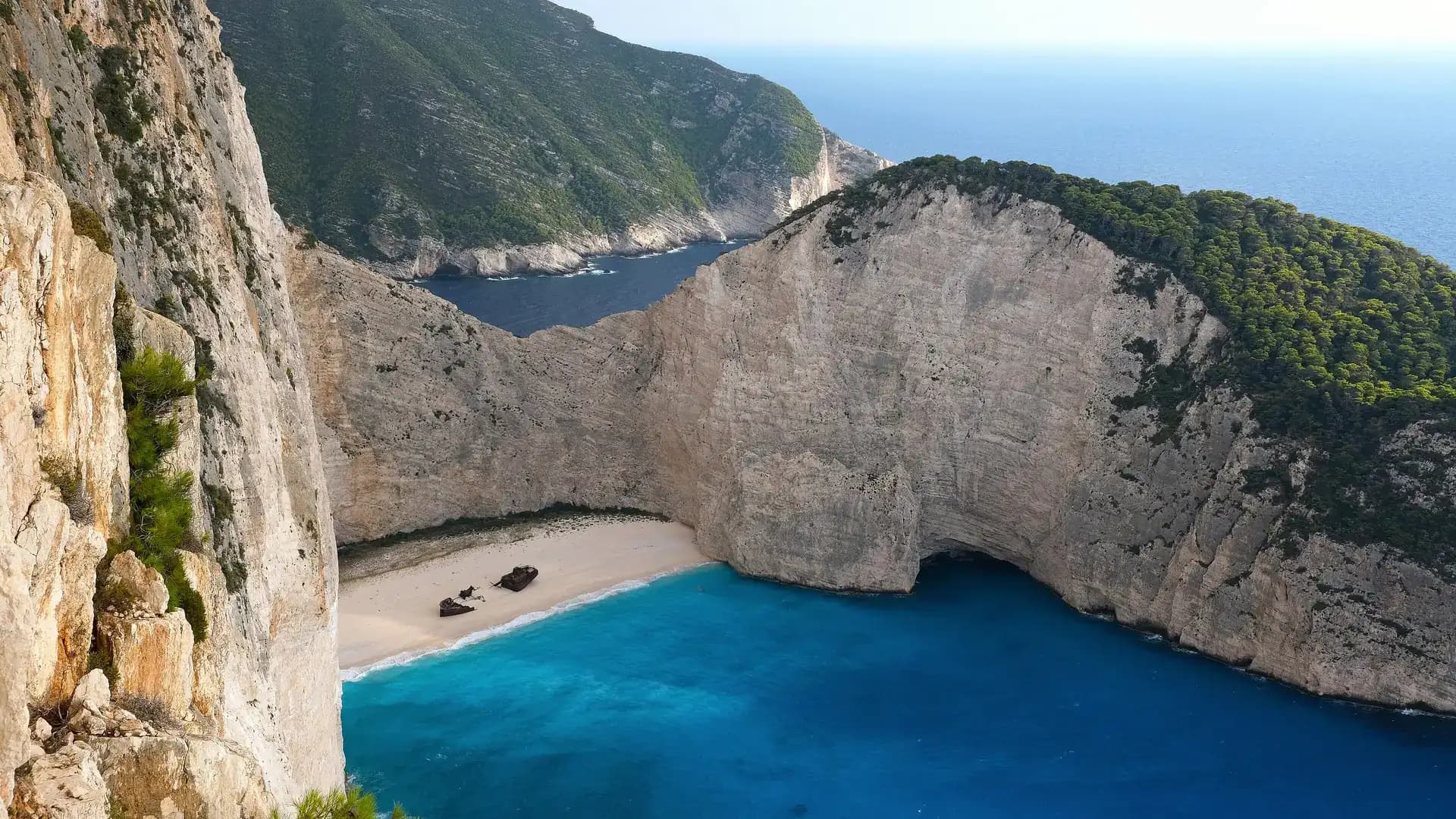 The iconic Navagio shipwreck beach surrounded by turquoise water, Zakynthos, Greece