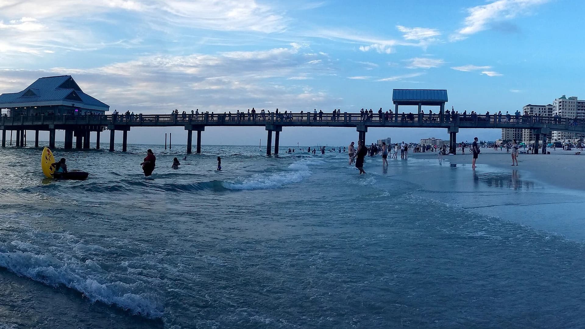 Pier 60 and beachgoers at sunset, Clearwater Beach, Florida