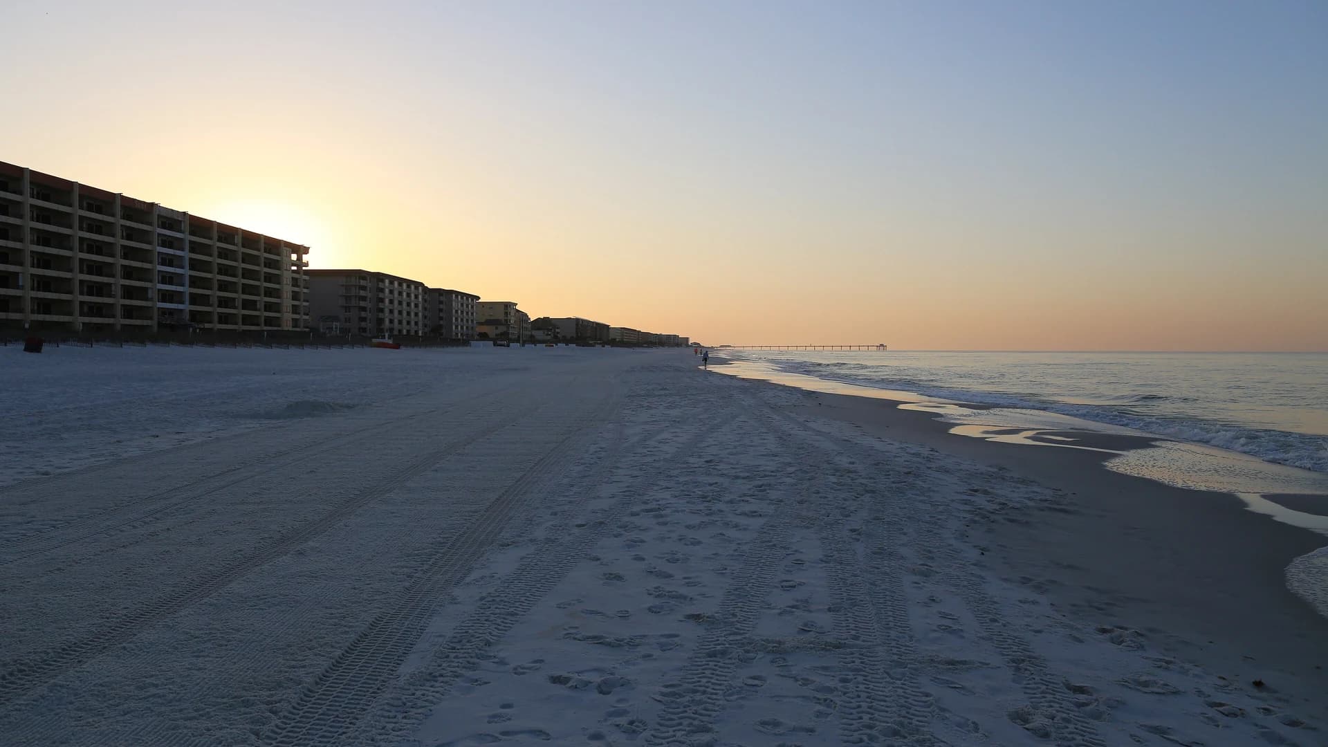 Sugar-white sand beach at sunrise with beachfront condos, Emerald Coast, Florida