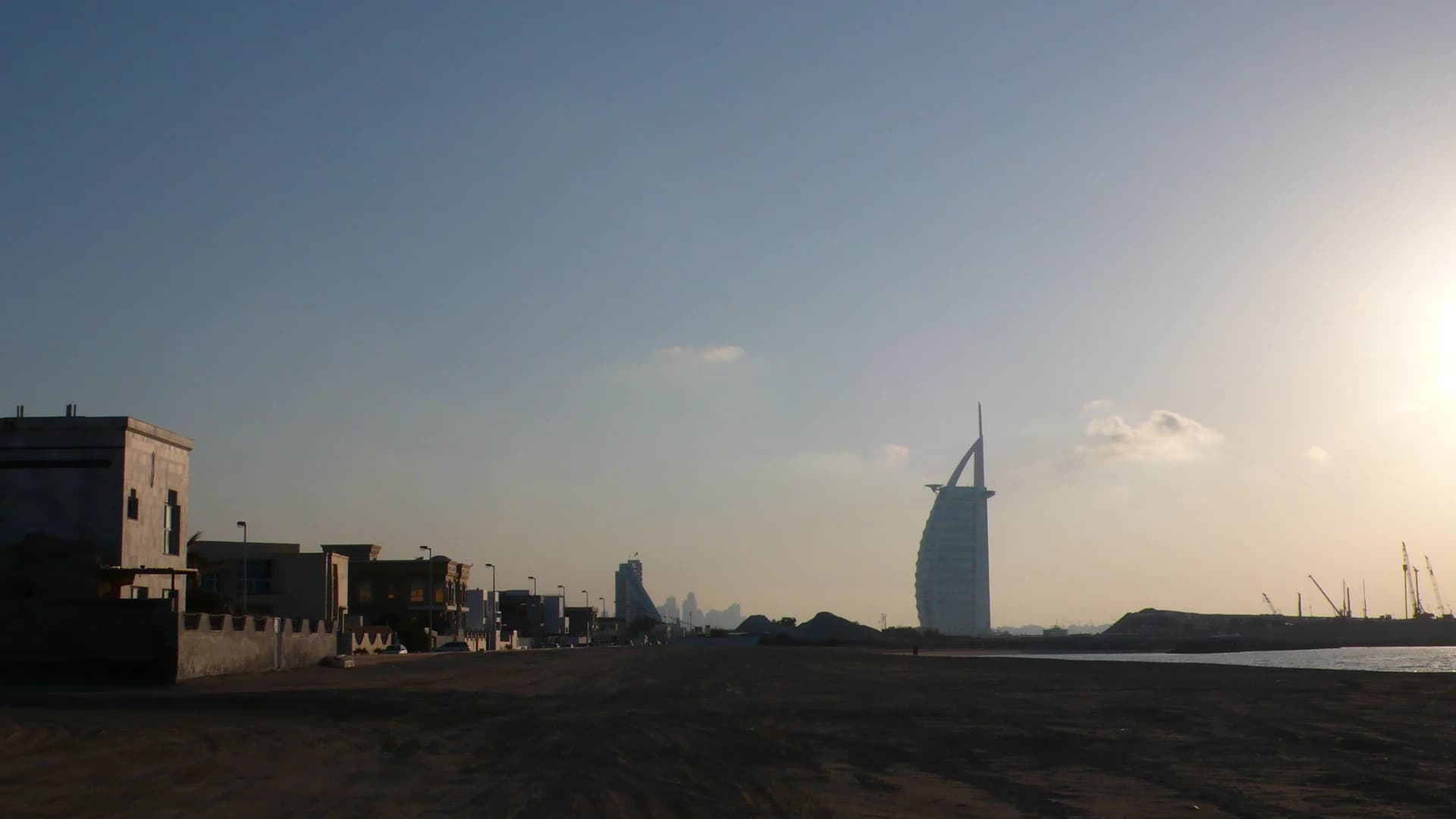 The Burj Al Arab seen across the water at dusk, Dubai
