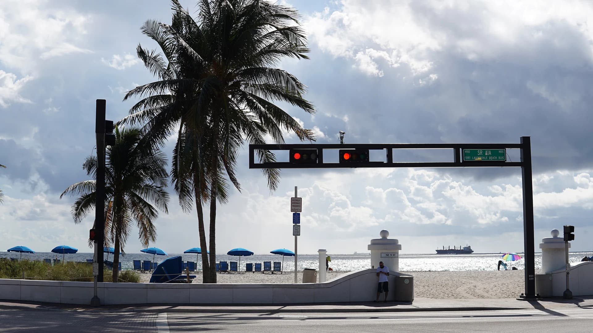 Fort Lauderdale Beach with palm trees and beach umbrellas along A1A, Florida