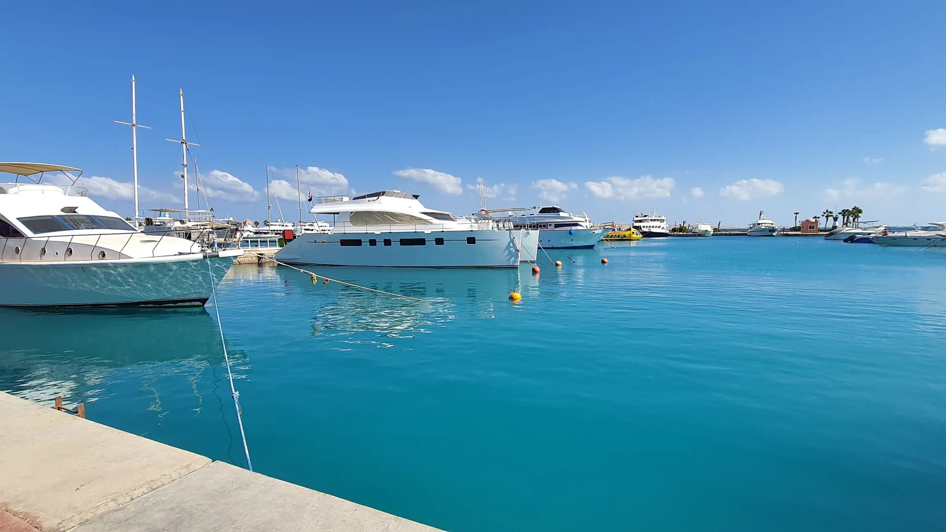 Yachts moored in Hurghada Marina under a clear sky, Egypt