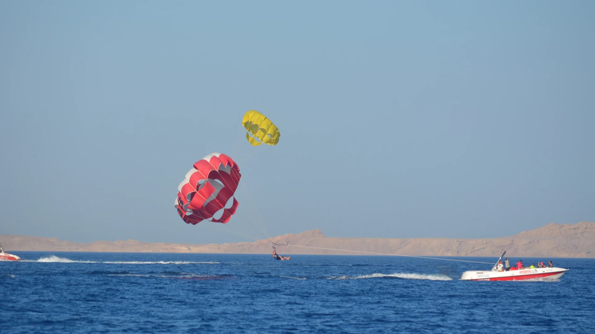 A parasail canopy towed behind a speedboat on the Red Sea near Hurghada, Egypt