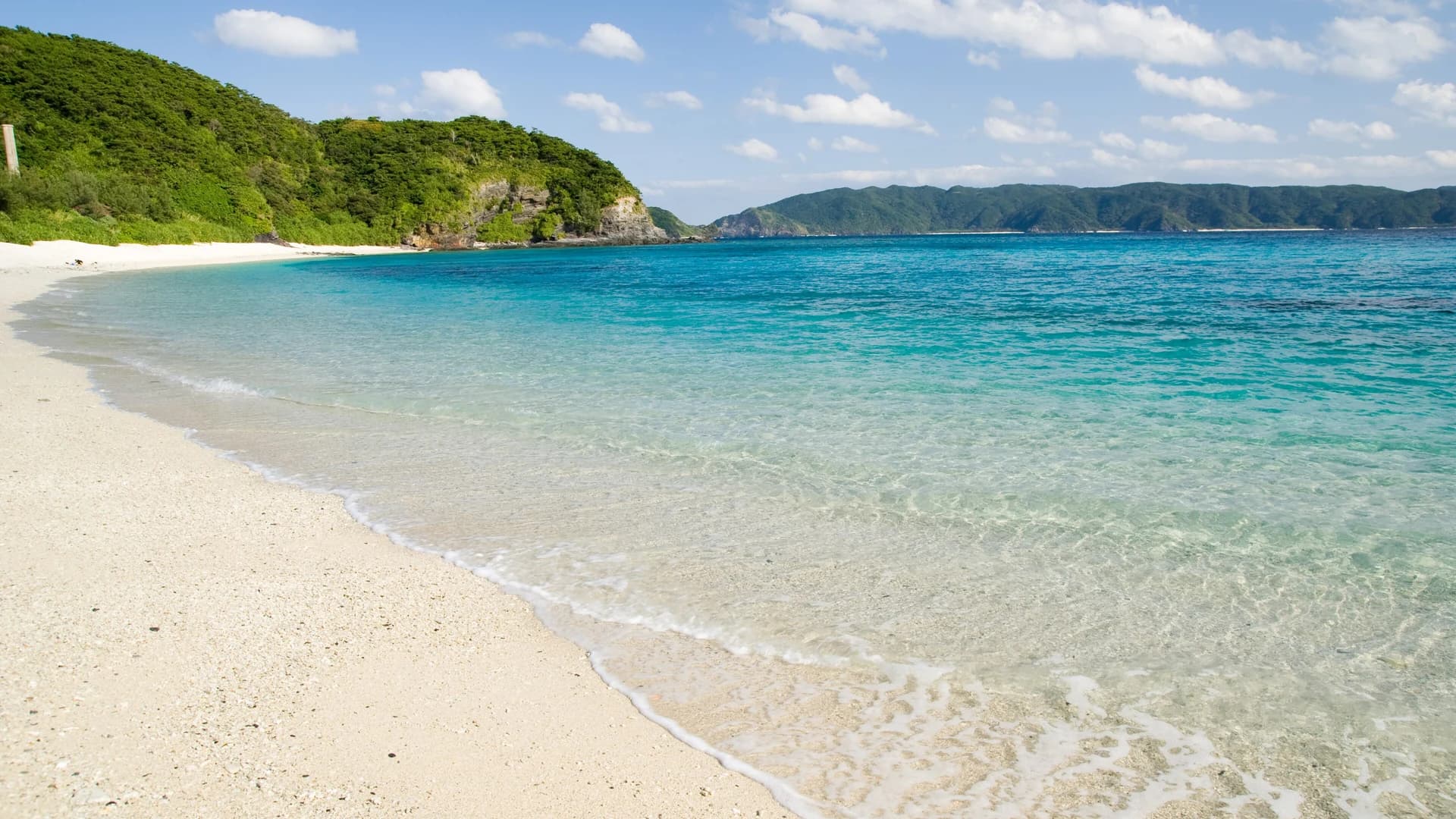Clear turquoise water and white sand at Furuzamami Beach, Zamami Island, near Okinawa