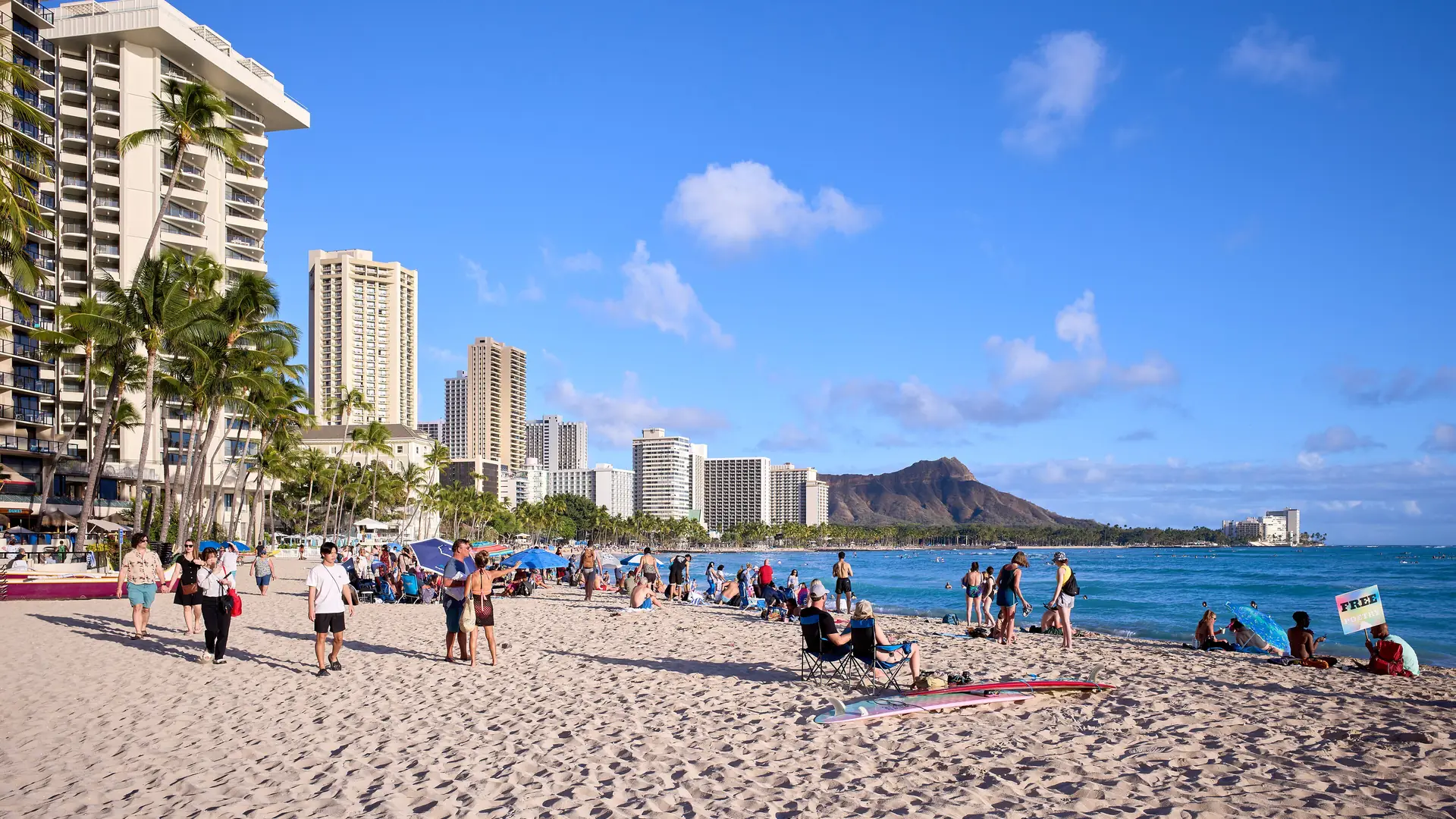 Waikiki Beach at sunrise with hotel towers and Diamond Head in the background, Honolulu, Oahu